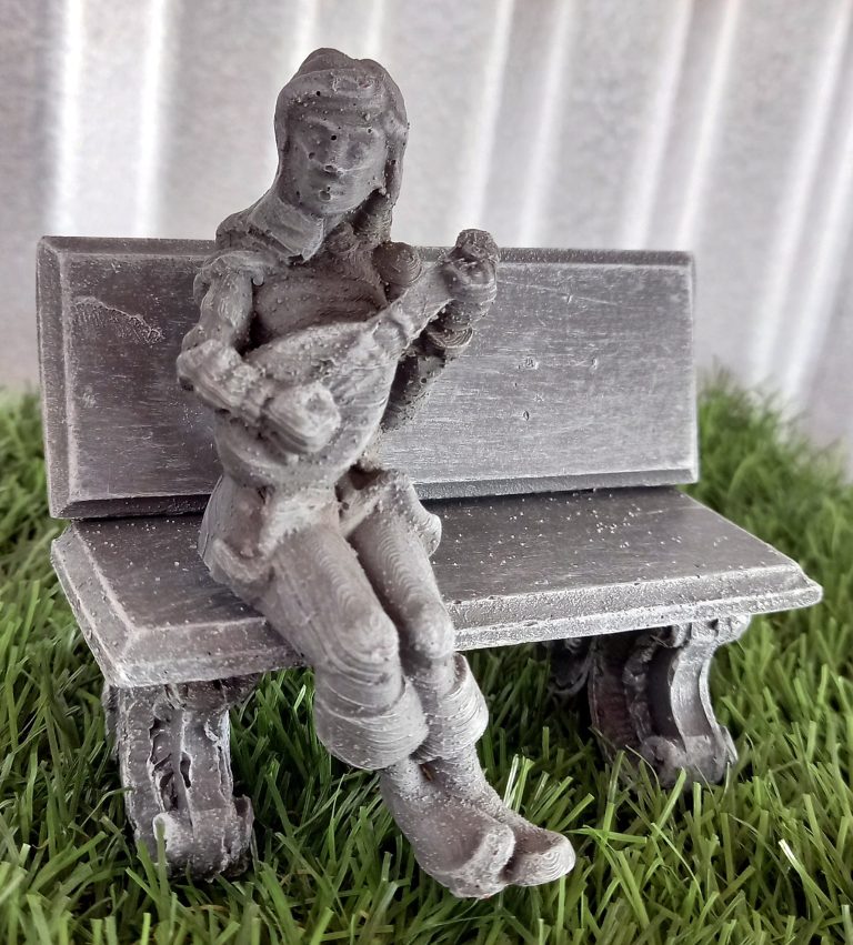 MS 096 – Man sitting on bench playing guitar